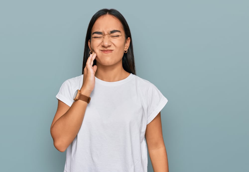 woman with jaw pain tmj